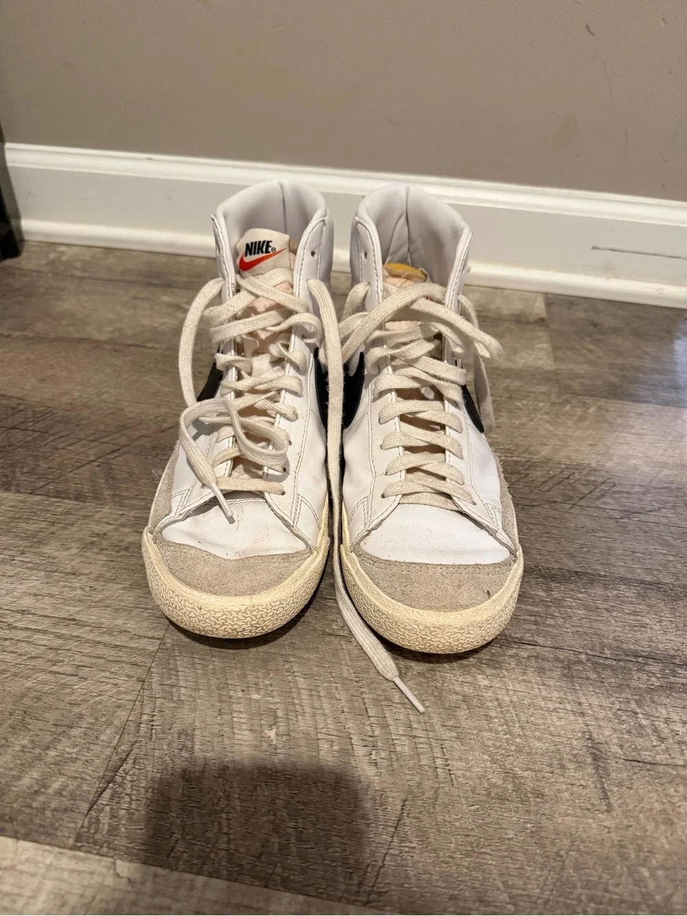 Nike High-Top Sneakers in White with Black Swoosh